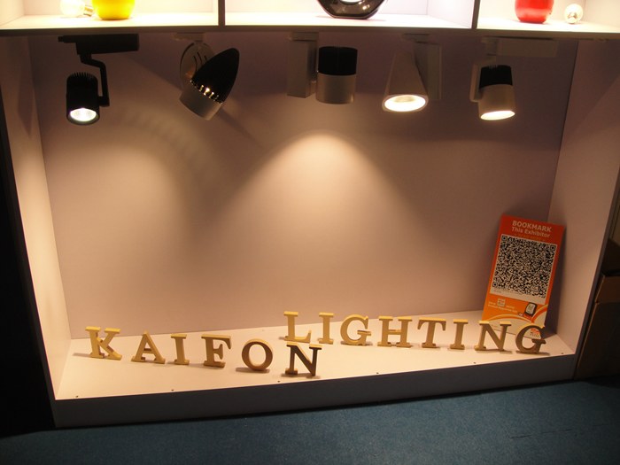 Track spotlights above KAIFON lettering at the exhibition stand.