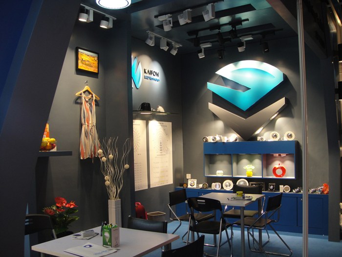 KAIFON exhibition stand with ceiling lights and illuminated wall displays.