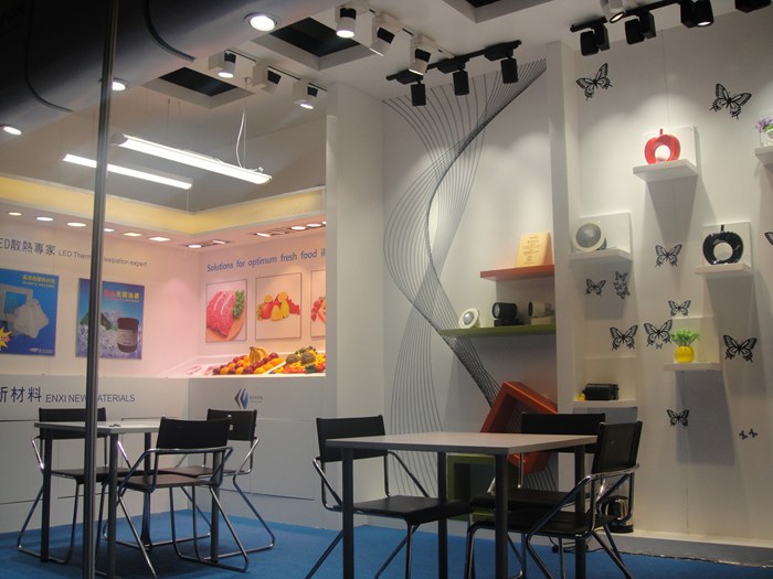 Illuminated display shelves and seating at the KAIFON stand.