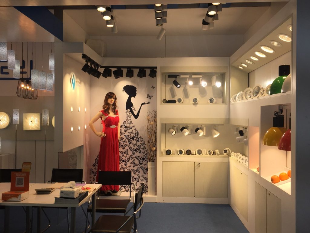 KAIFON exhibition stand with track spotlights and display shelves.