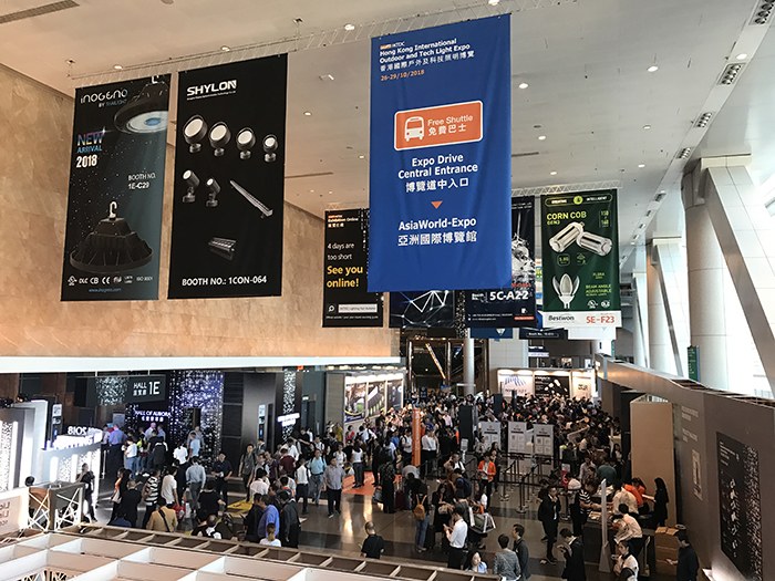 People moving through the exhibition venue entrance hall.