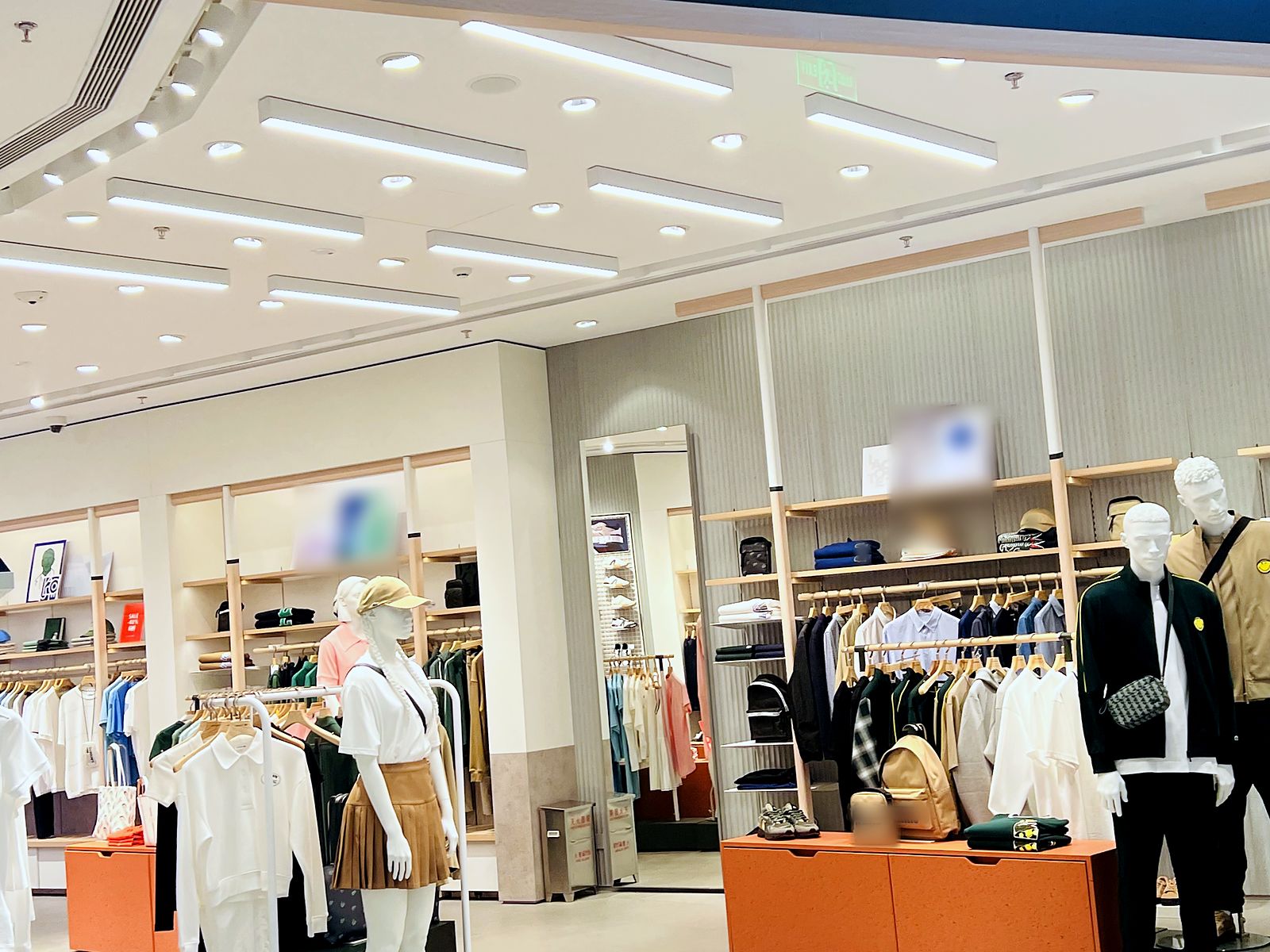 Recessed downlights in a sportswear store ceiling